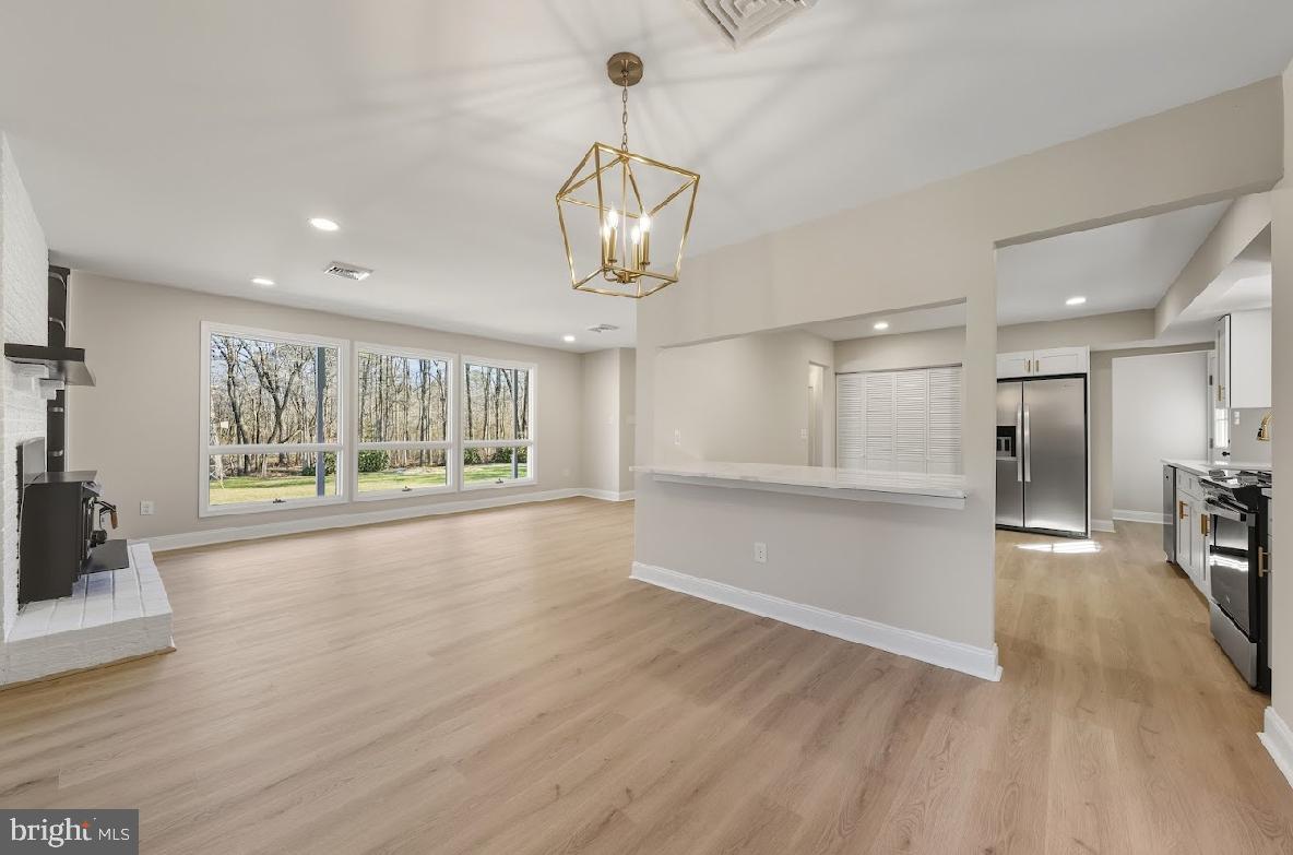825 Mays Landing Road Hammonton, NJ 08037 - Photo 11 of 33 a view of empty room with wooden floor and fireplace