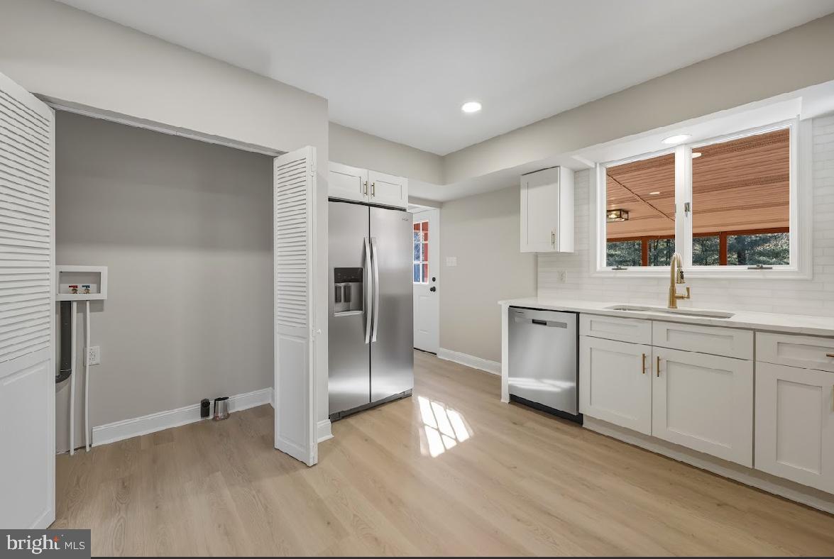 825 Mays Landing Road Hammonton, NJ 08037 - Photo 13 of 33 a kitchen with stainless steel appliances a refrigerator and a sink