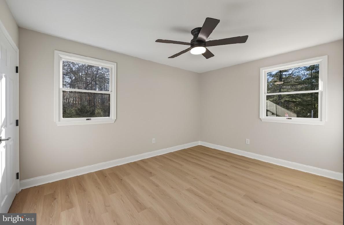 825 Mays Landing Road Hammonton, NJ 08037 - Photo 17 of 33 a view of a big room with wooden floor and windows
