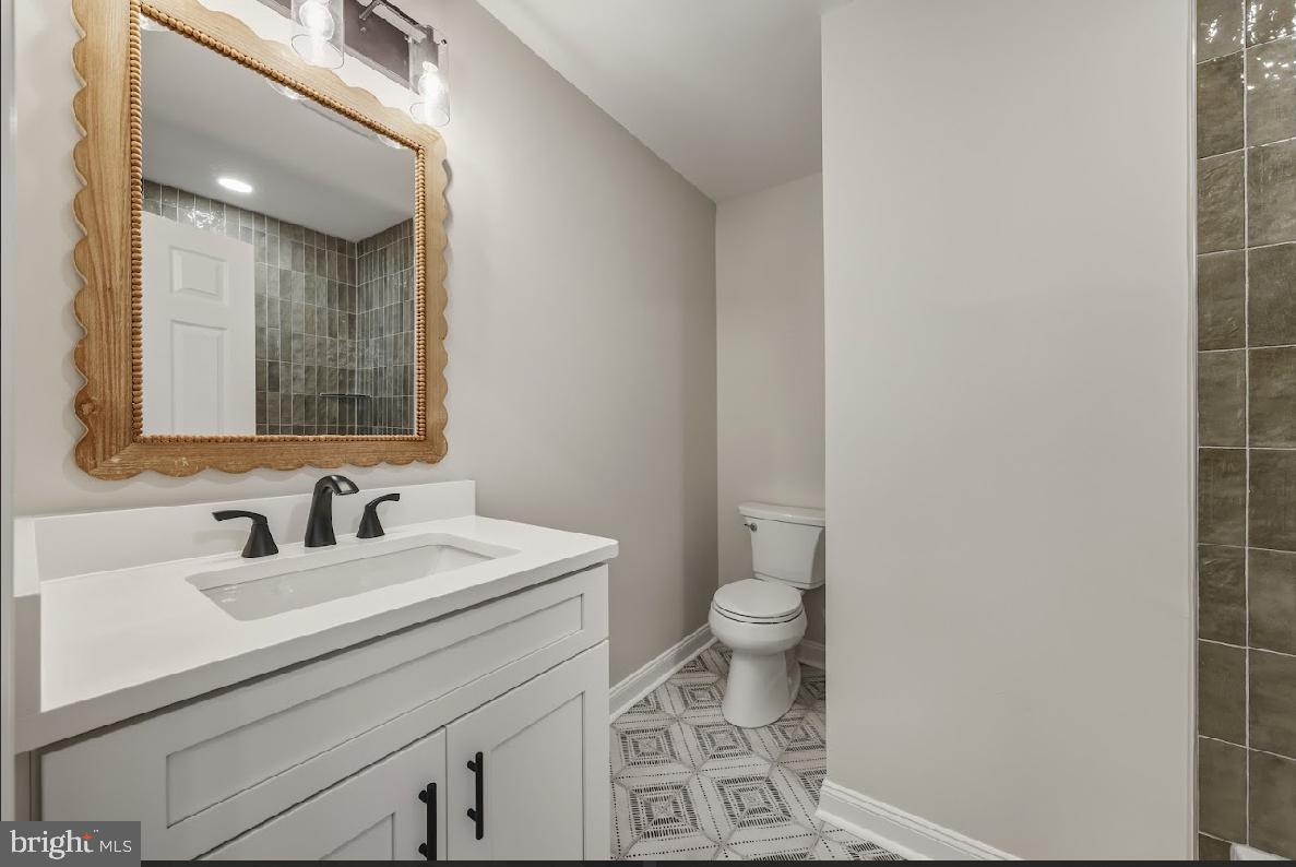 825 Mays Landing Road Hammonton, NJ 08037 - Photo 20 of 33 a bathroom with a sink and a mirror