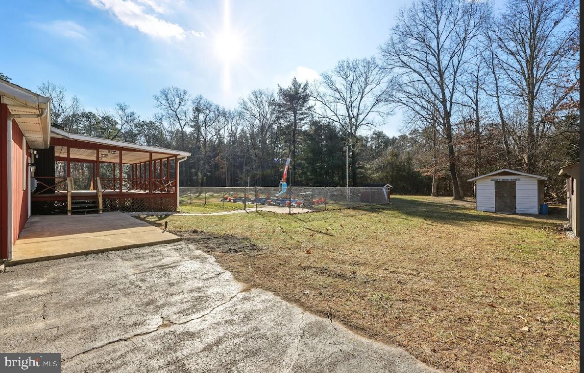 825 Mays Landing Road Hammonton, NJ 08037 - Photo 30 of 33 a view of a house with backyard and trees