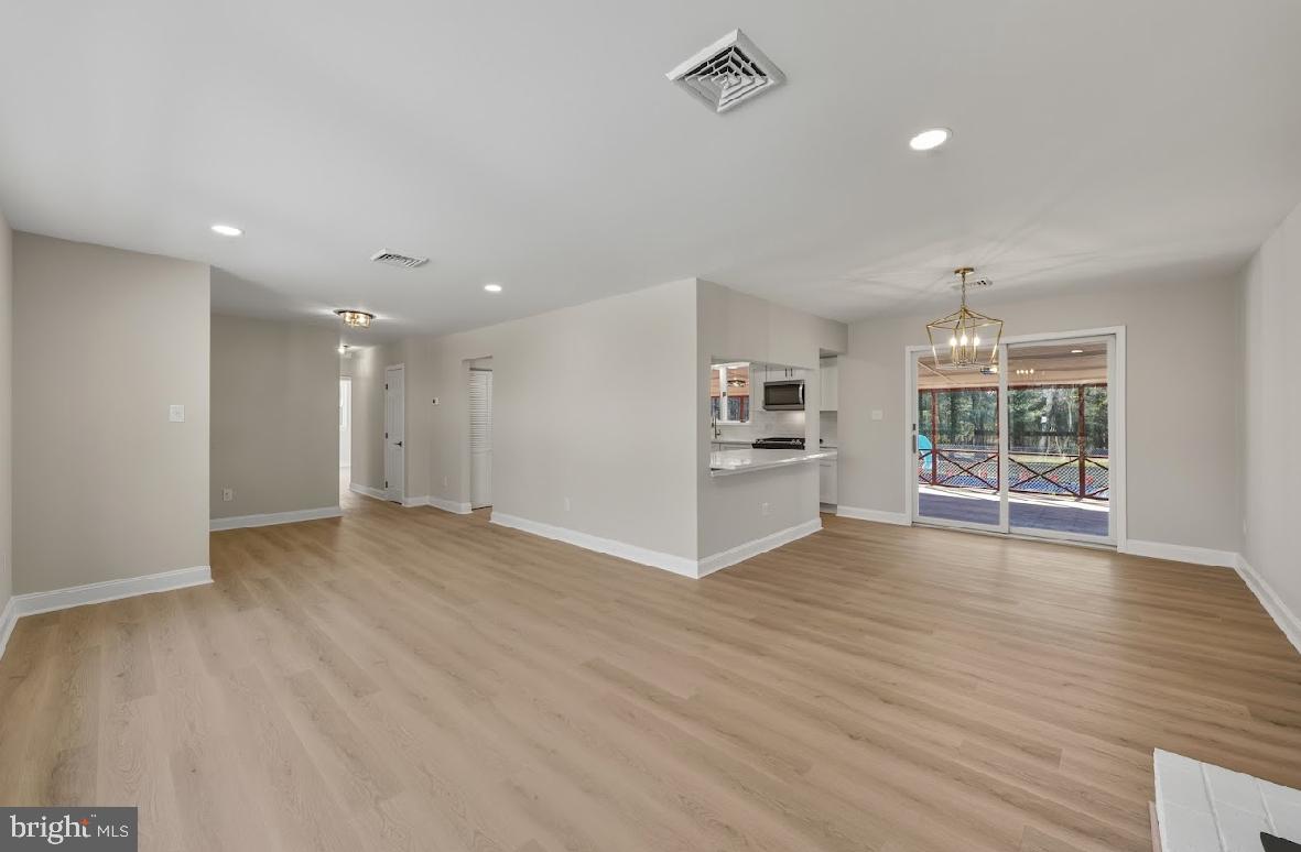 825 Mays Landing Road Hammonton, NJ 08037 - Photo 5 of 33 a view of wooden floor and windows in a room