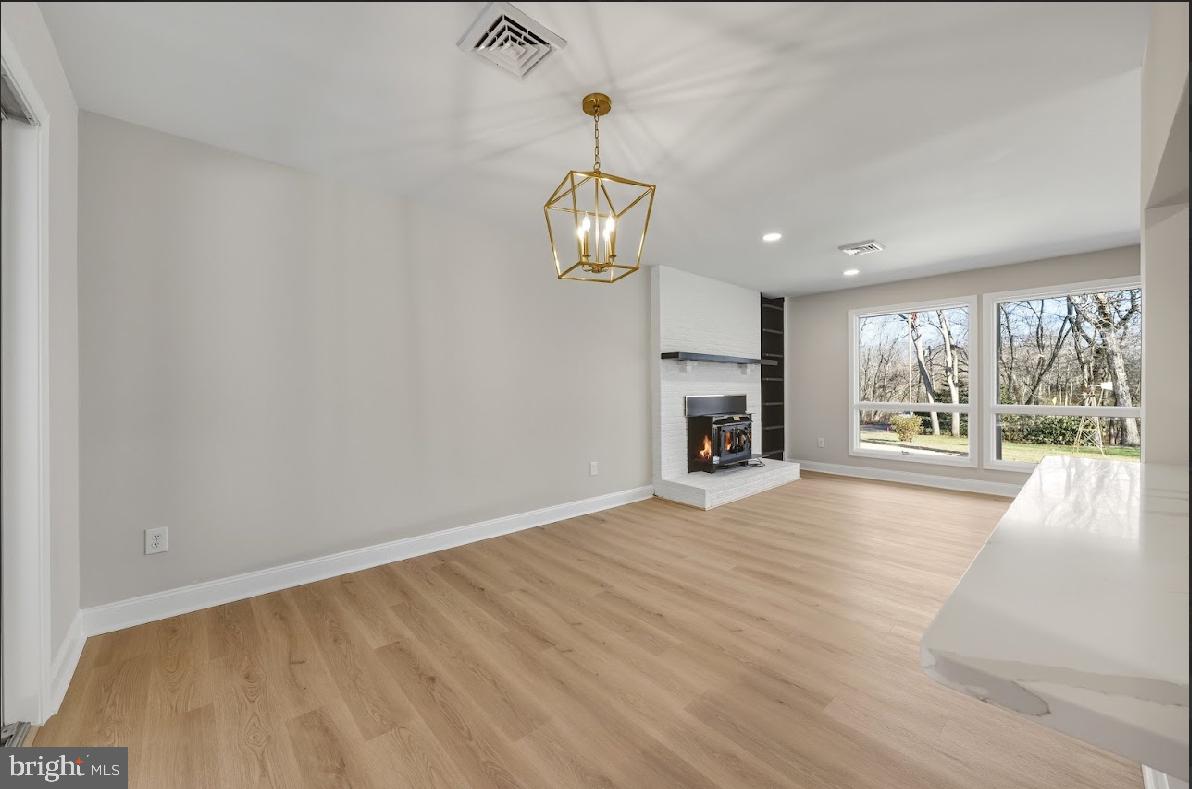 825 Mays Landing Road Hammonton, NJ 08037 - Photo 9 of 33 a view of an empty room with a window and kitchen view