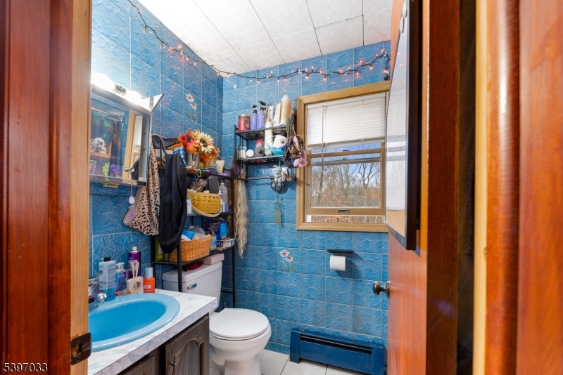 43 Meyers Road Montague, NJ 07827 - Photo 13 of 23 a bathroom with a toilet a sink and a shower curtain