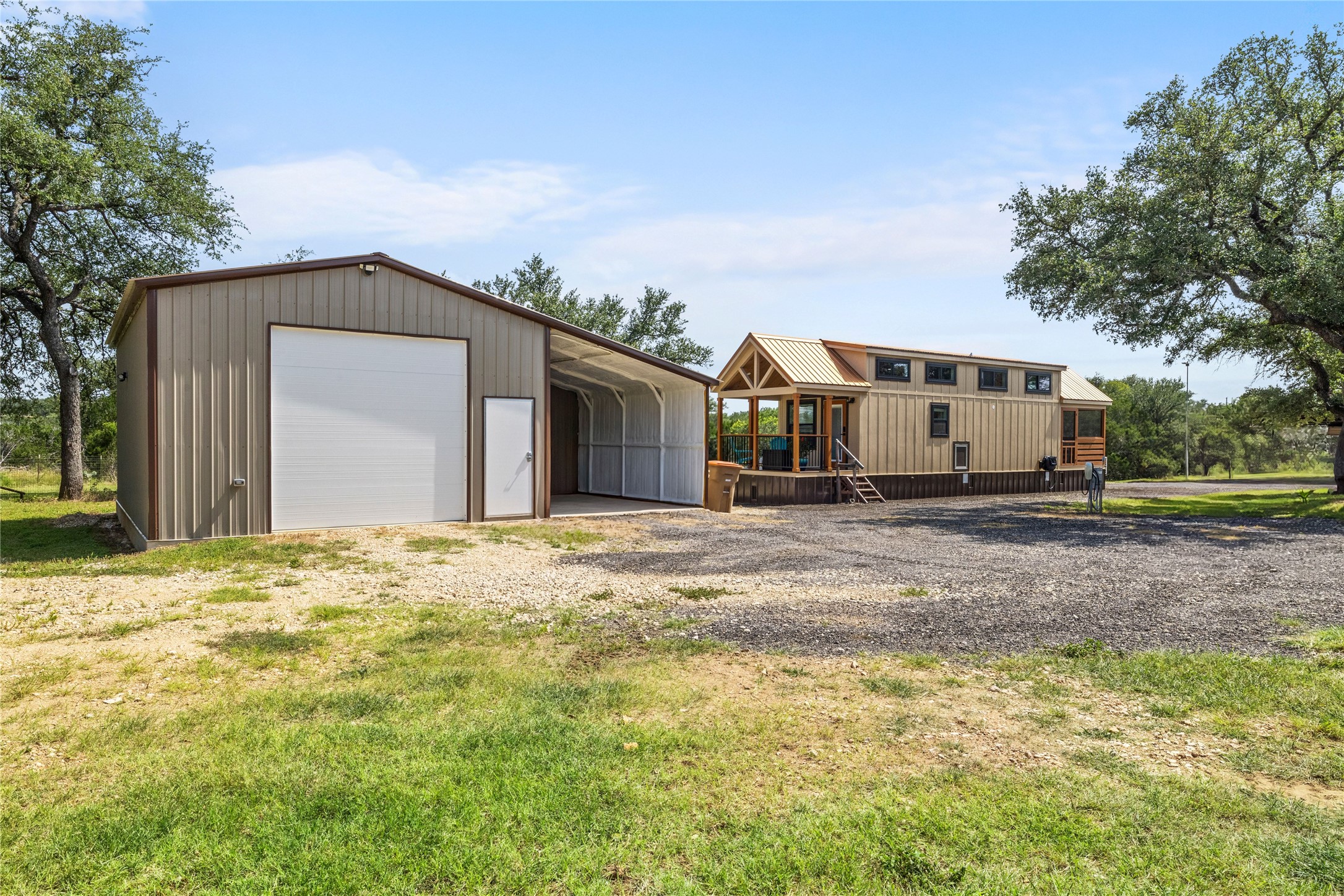 8200 Ranch Road 12 San Marcos, TX 78666 - Photo 29 of 40 A spacious gravel parking area complements the barn and adjacent cozy home.