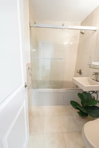 a bathroom with a bathtub and a shower
