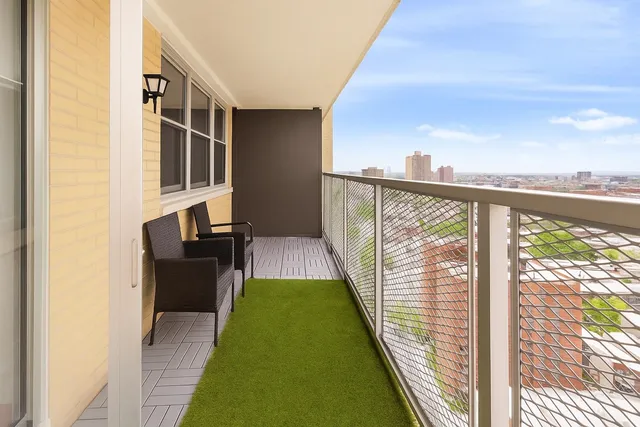 a balcony with view of outdoor space