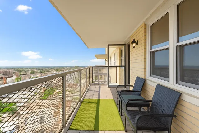 a view of balcony with furniture