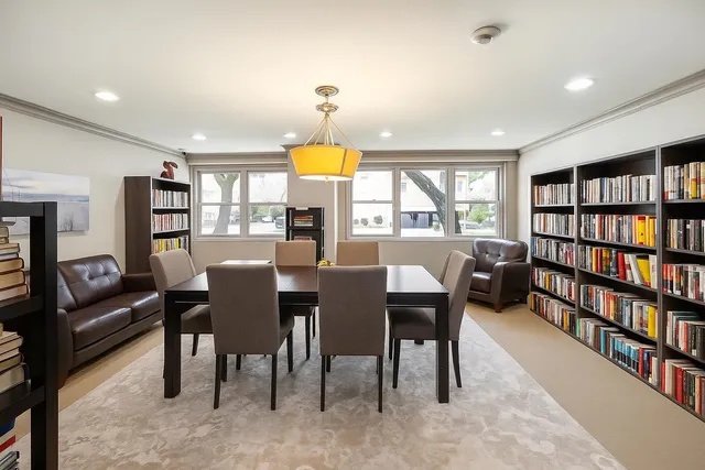 a view of a a dining room with furniture window and wooden floor