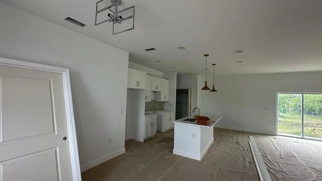 a view of a kitchen and a sink