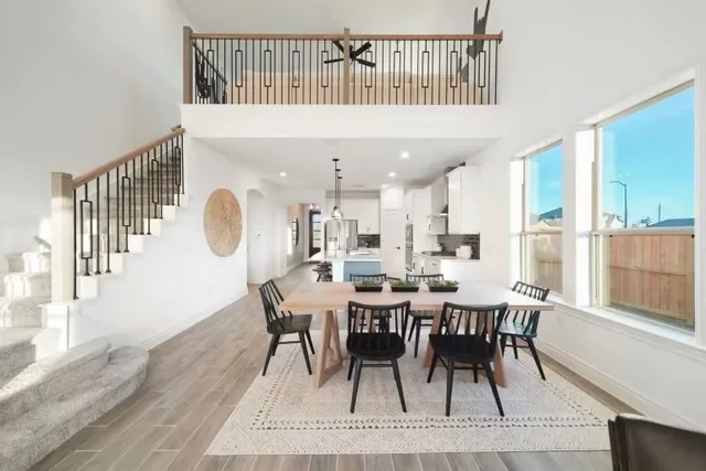a view of a dining room with furniture and a window