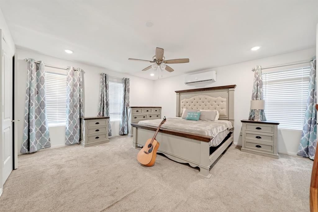 505 Laurel Road Athens, TX 75751 - Photo 18 of 32 Spacious room featuring plush carpet, white walls, multiple windows with blinds, a ceiling fan, and recessed lighting