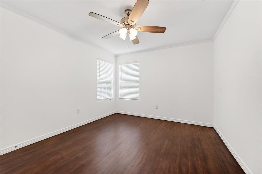 505 Laurel Road Athens, TX 75751 - Photo 24 of 32 Spacious room featuring rich wood-finish flooring, white walls, and a ceiling fan with integrated lighting