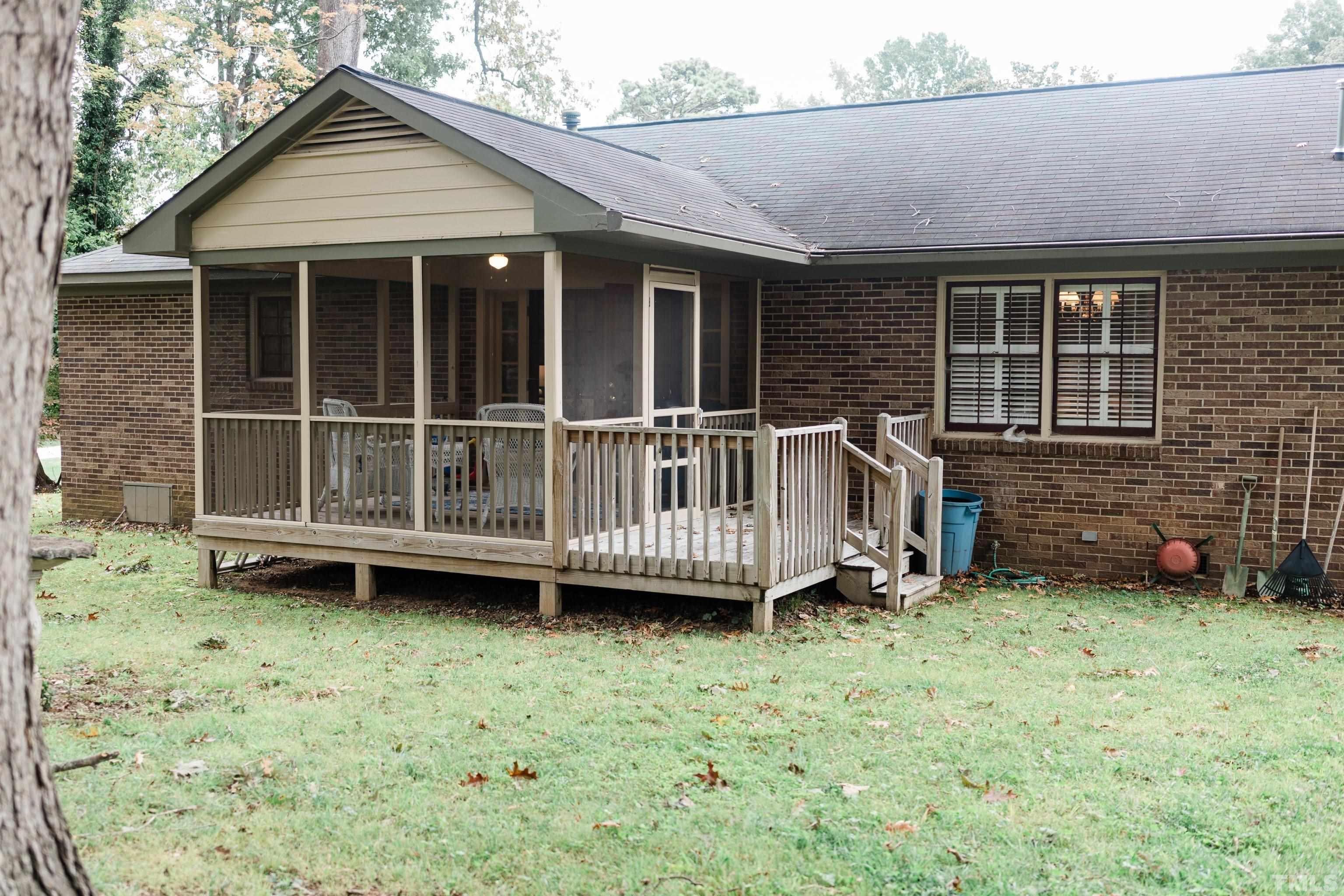 423 East Rowan Street Raleigh, NC 27609 - Photo 19 of 20 a view of a house with a backyard and deck
