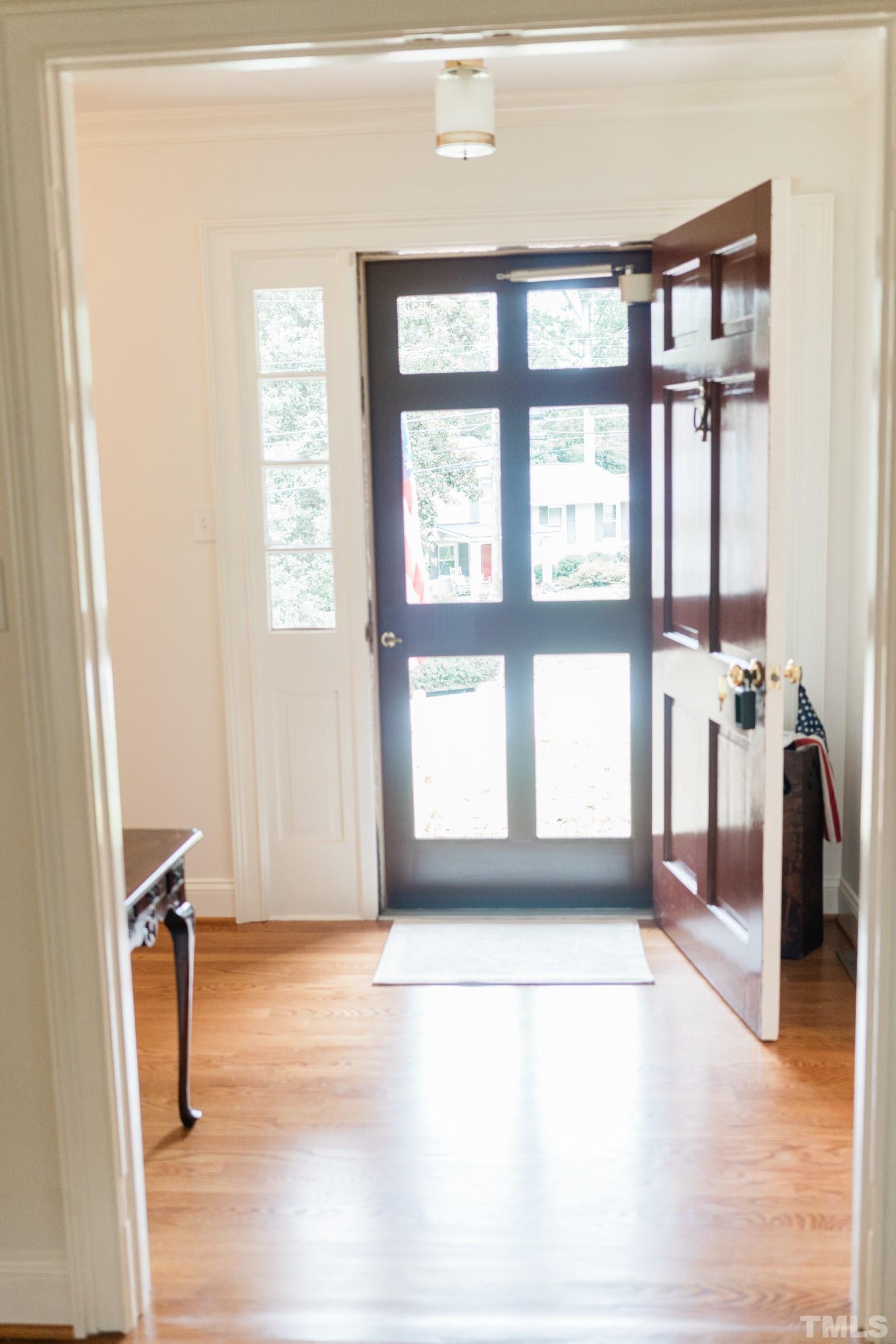 423 East Rowan Street Raleigh, NC 27609 - Photo 3 of 20 a view of an empty room with a window