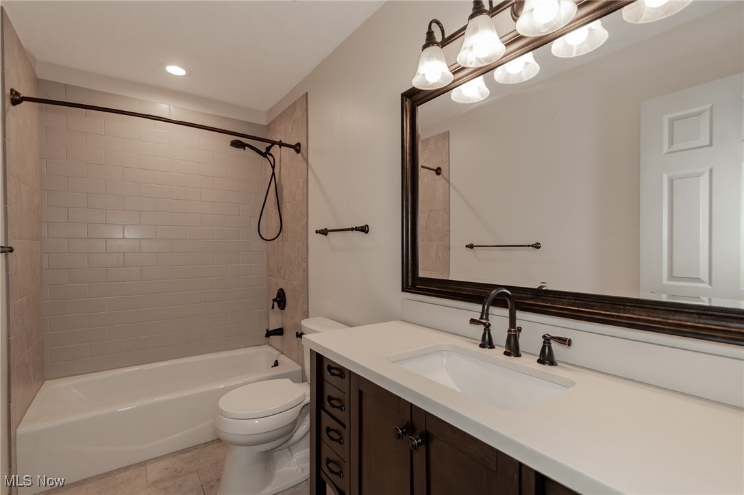 4815 South Ridge Road Perry, OH 44081 - Photo 28 of 48 Bathroom featuring vanity and shower / washtub combination