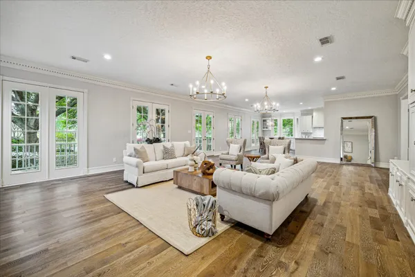 a kitchen with granite countertop appliances cabinets and a dining table