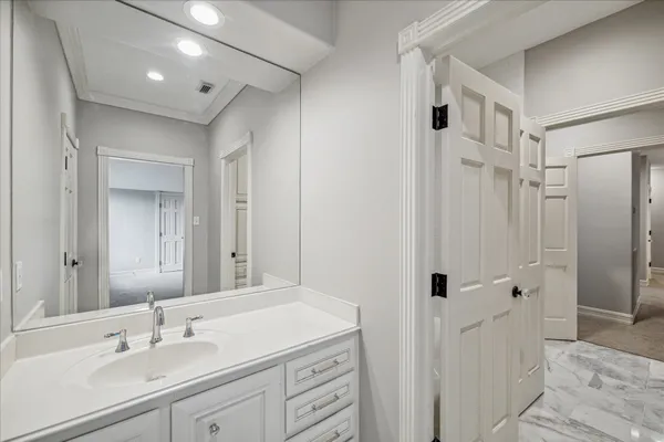 a bathroom with a sink double vanity and a mirror