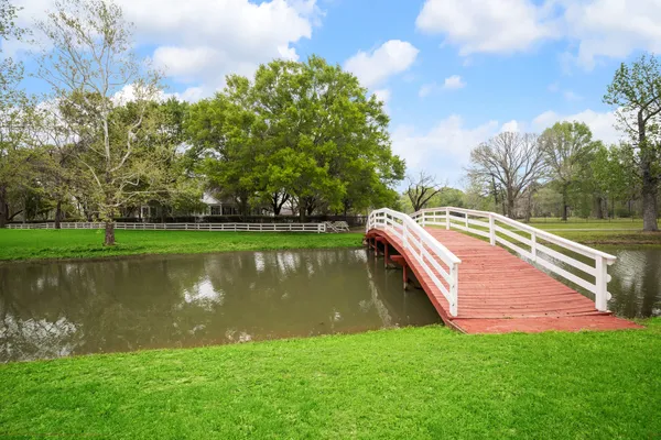 a view of a lake with a yard