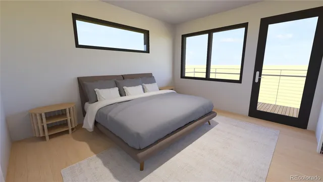 a large bed sitting in a bedroom next to a window