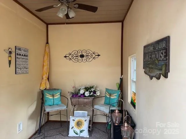 a view of a dining room with furniture and a potted plant