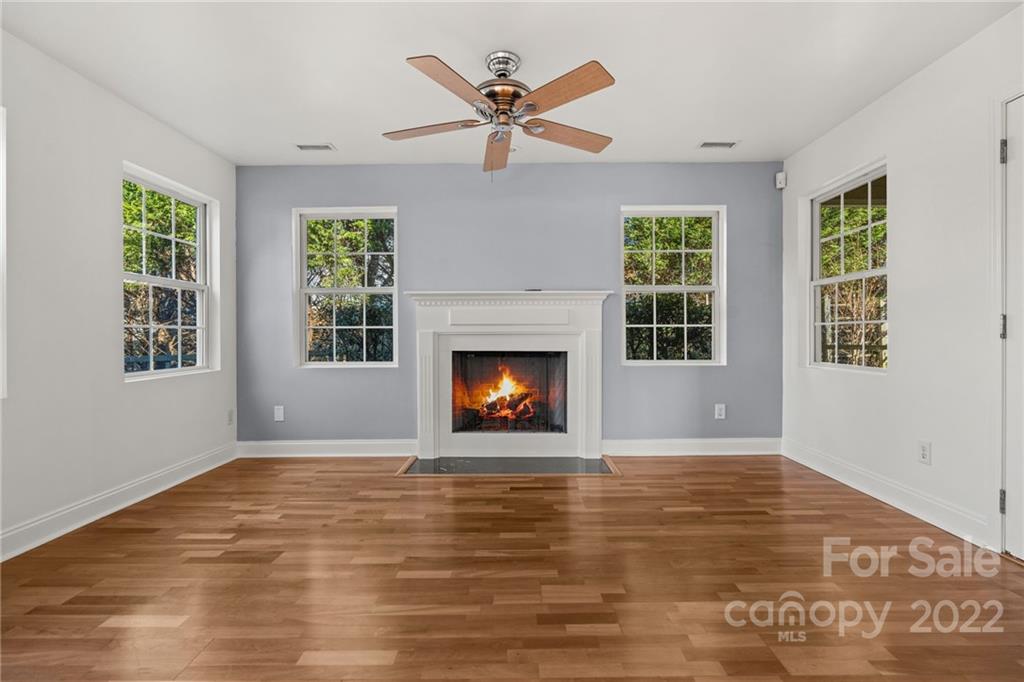 38 Grove End Road, Unit LOT/2 Fletcher, NC 28732 - Photo 15 of 39 a view of an empty room with exposed radiator and fireplace