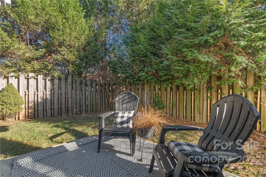 38 Grove End Road, Unit LOT/2 Fletcher, NC 28732 - Photo 32 of 39 a view of a wooden chairs and backyard