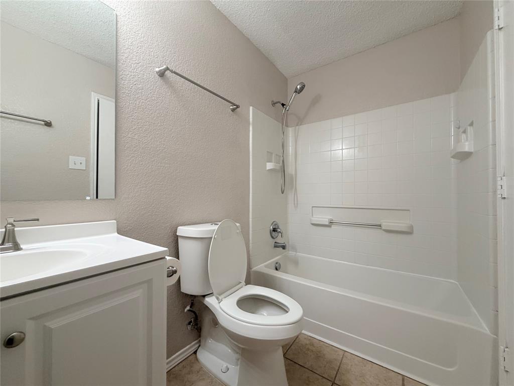 1826 Trailview Drive Terrell, TX 75160 - Photo 11 of 27 a bathroom with a sink toilet vanity and shower
