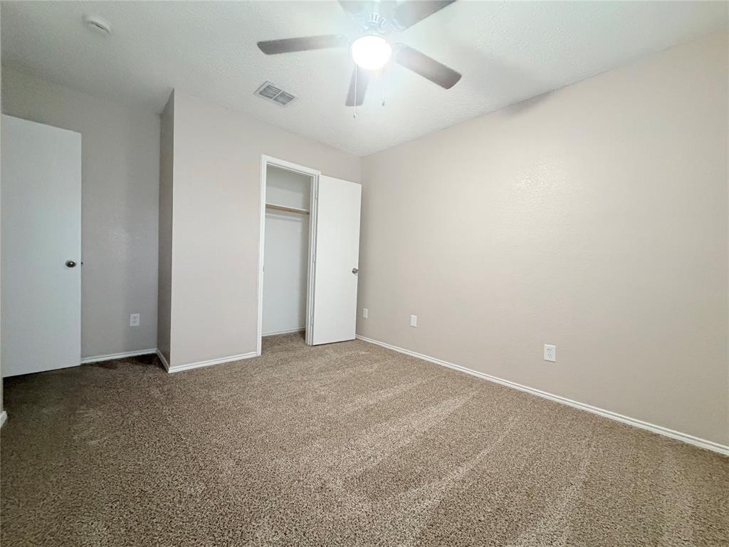 1826 Trailview Drive Terrell, TX 75160 - Photo 13 of 27 a view of an empty room with a ceiling fan