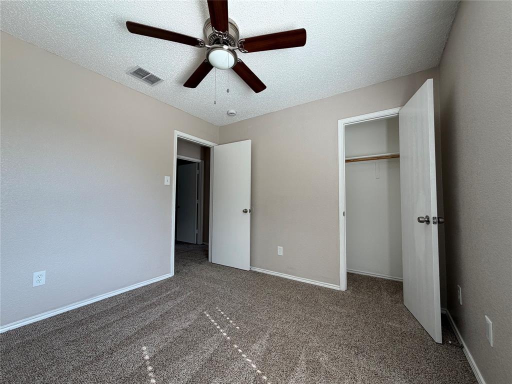 1826 Trailview Drive Terrell, TX 75160 - Photo 16 of 27 a view of an empty room and a ceiling fan