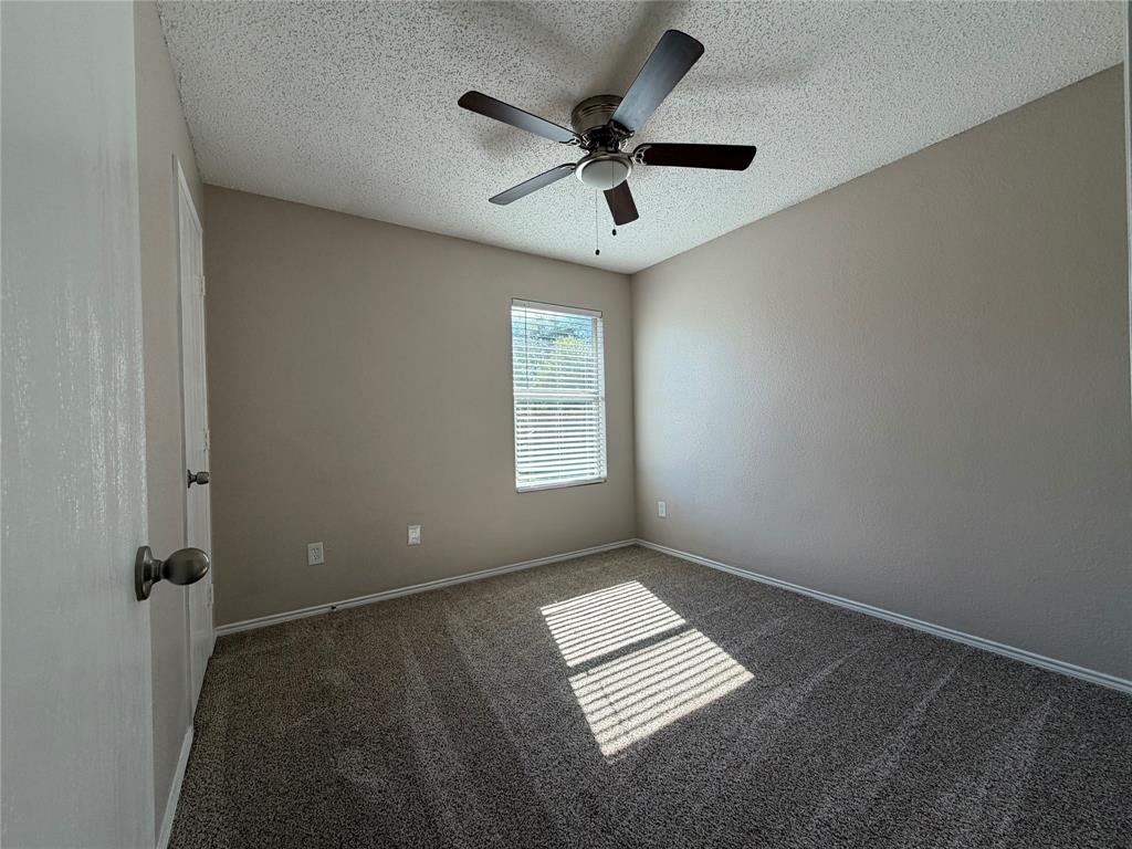 1826 Trailview Drive Terrell, TX 75160 - Photo 17 of 27 wooden floor in an empty room with a window