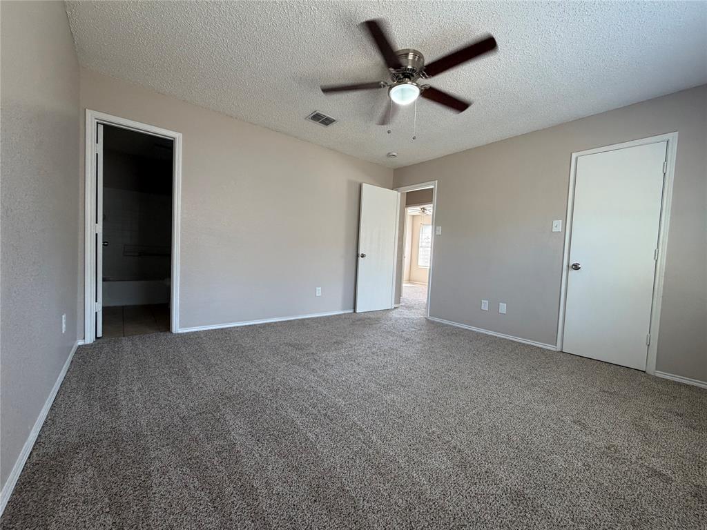 1826 Trailview Drive Terrell, TX 75160 - Photo 20 of 27 an empty room with a ceiling fan and a ceiling fan