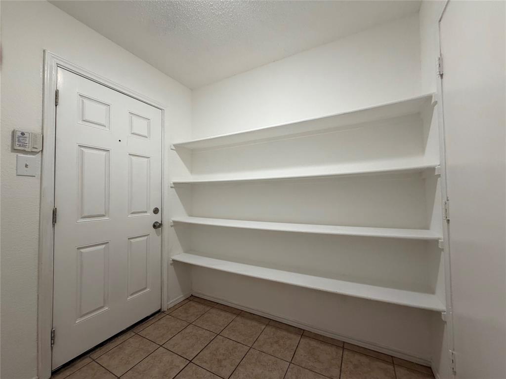 1826 Trailview Drive Terrell, TX 75160 - Photo 26 of 27 a view of walk in closet with empty racks
