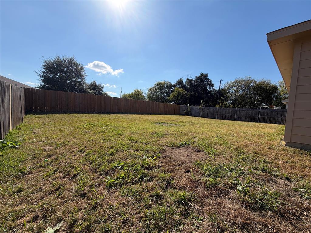 1826 Trailview Drive Terrell, TX 75160 - Photo 27 of 27 a view of patio with swimming pool and trees in the background