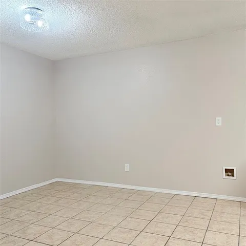 a white kitchen with a sink and cabinets
