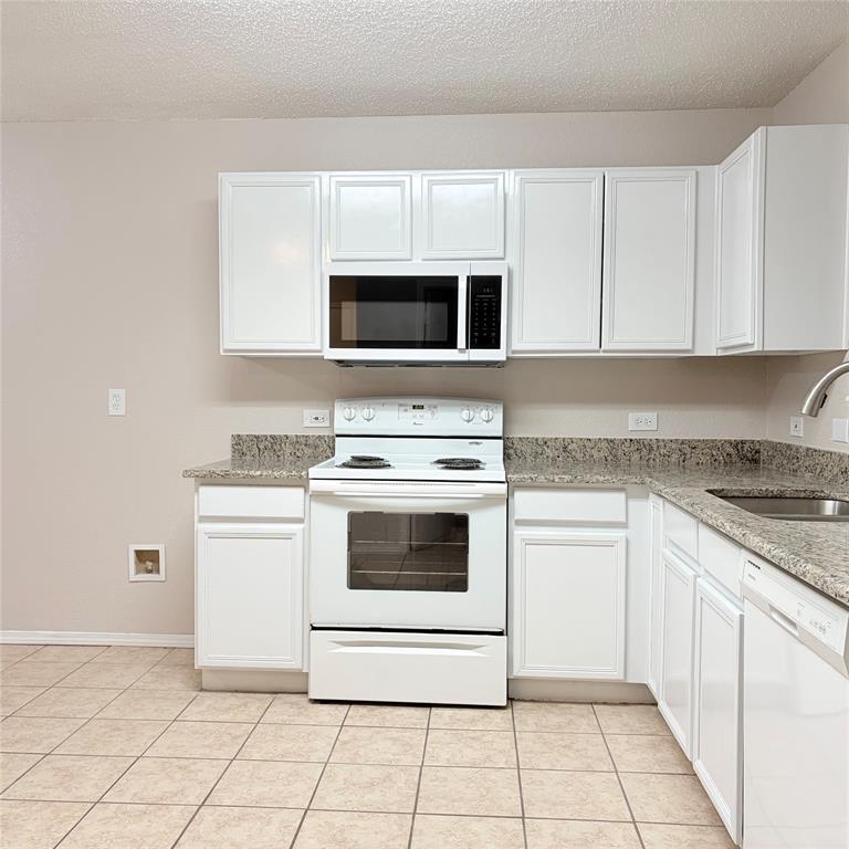 1826 Trailview Drive Terrell, TX 75160 - Photo 7 of 27 a kitchen with cabinets stainless steel appliances and a sink
