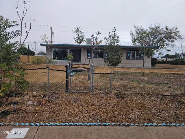 a view of a house with backyard and chair