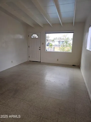 a view of an empty room with a window