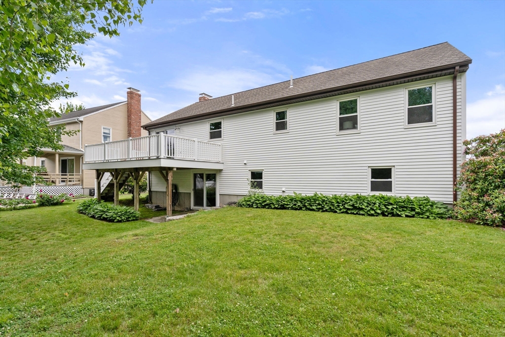 16 Shelley Road Arlington, MA 02476 - Photo 26 of 30 a view of a house with a yard and garage