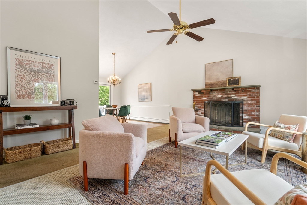 16 Shelley Road Arlington, MA 02476 - Photo 3 of 30 a living room with furniture and a fireplace