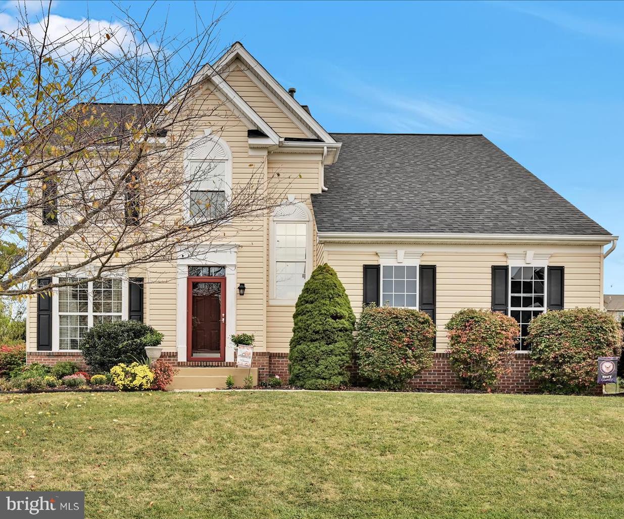 a front view of a house with a yard