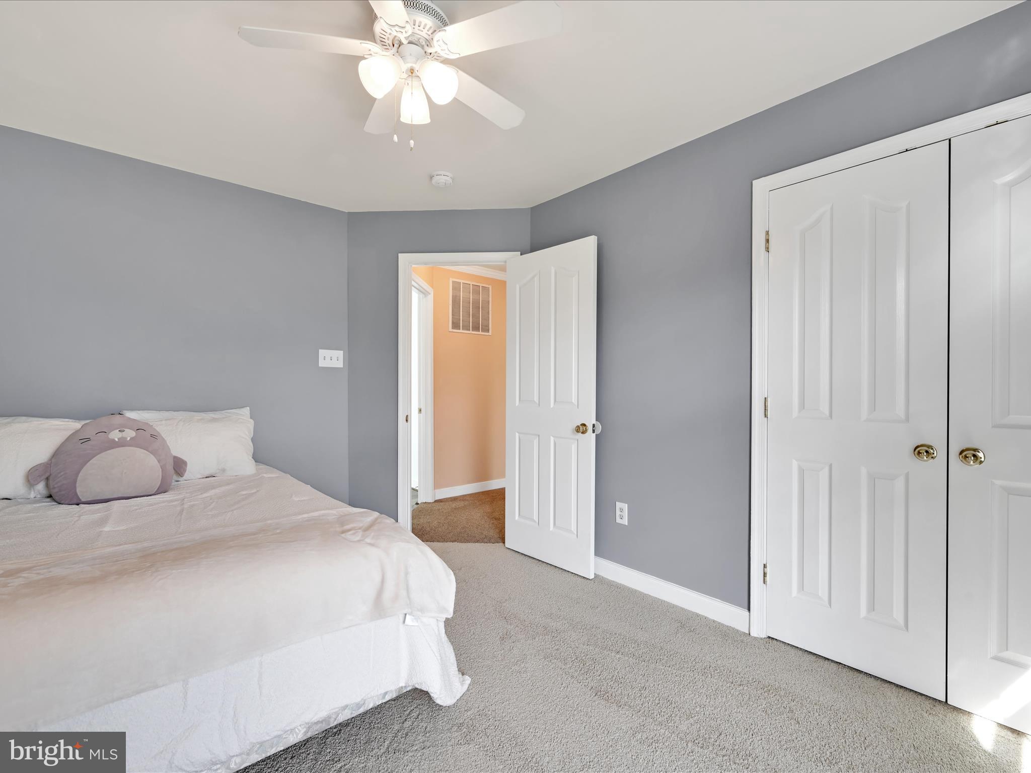 7641 Pinewild Road Seven Valleys, PA 17360 - Photo 25 of 42 a bedroom with a bed and a chandelier