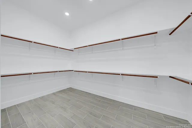 a view of an empty walk in closet
