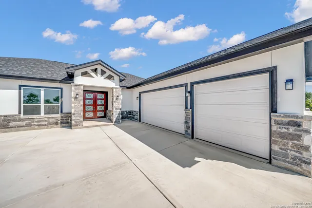 a view of a house with a garage
