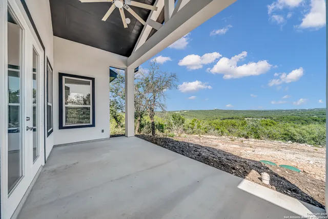 a view of a street with a big yard