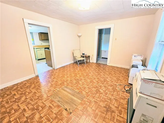 a bedroom with a bed and a mirror