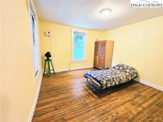 a living room with couch and a window