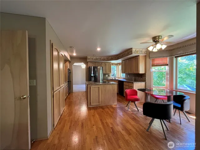 a view of a livingroom with furniture and a window