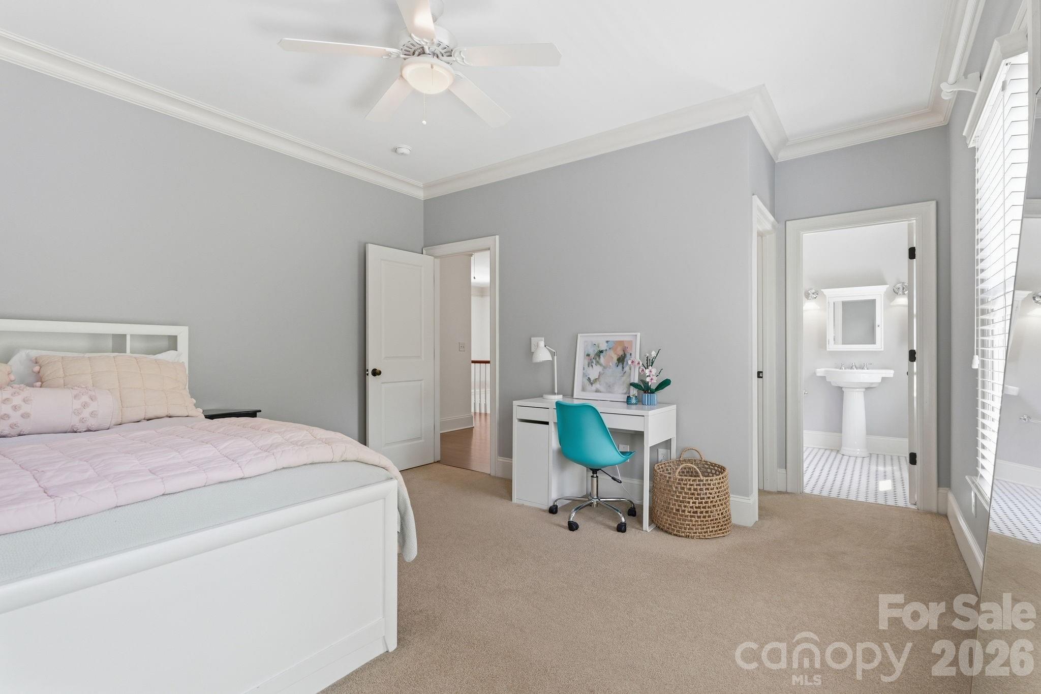 235 Grey Road Davidson, NC 28036 - Photo 20 of 42 a bedroom with a bed and a chandelier