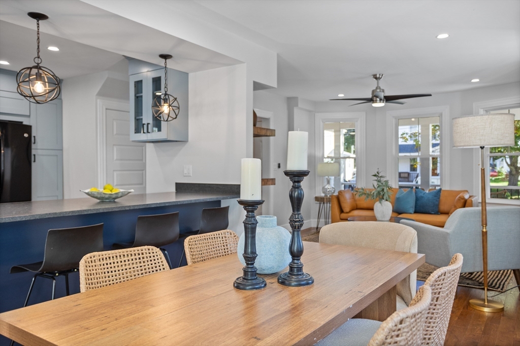 20 Tremont Street Maynard, MA 01754 - Photo 11 of 29 a dining room with wooden floor a glass table and chairs
